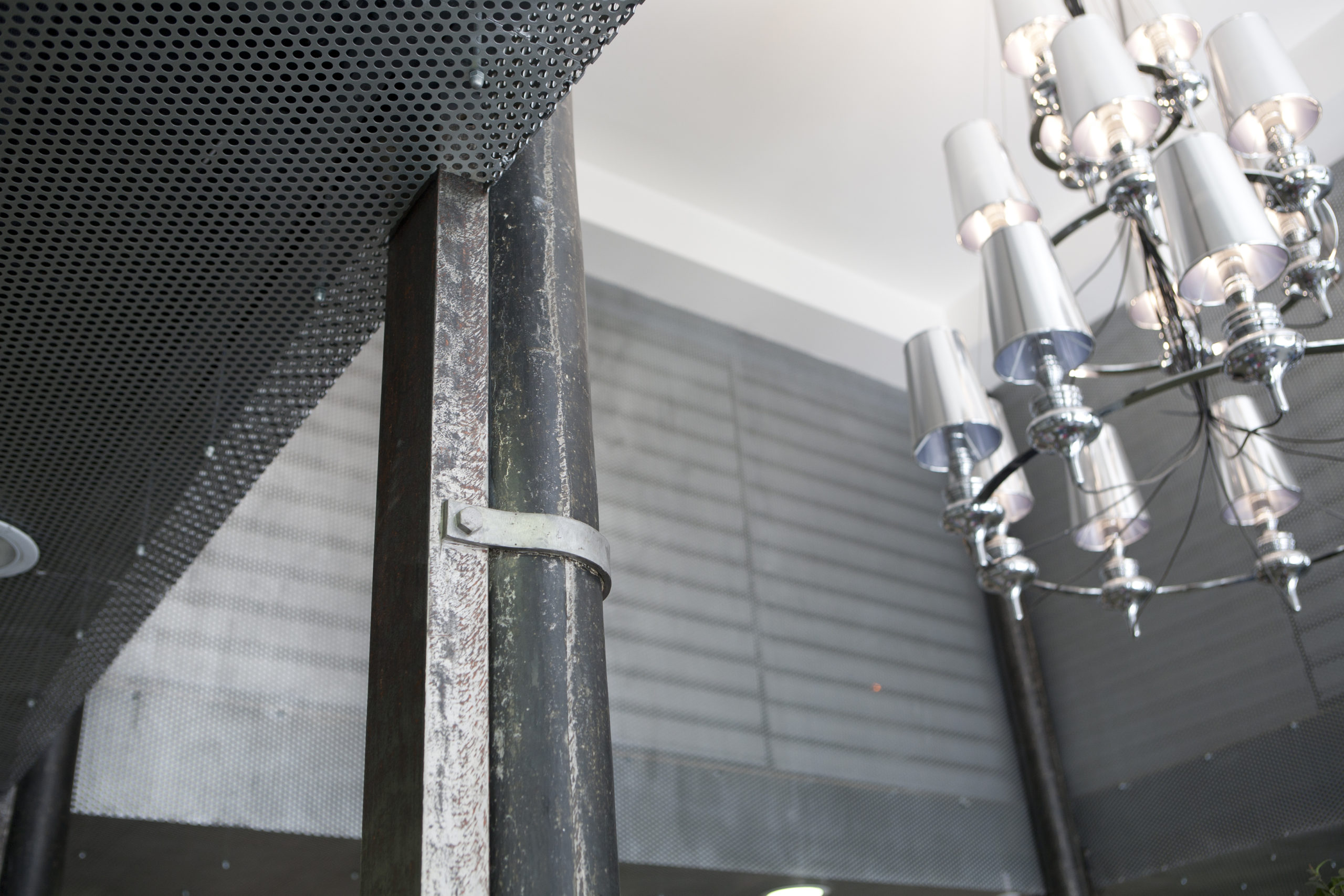 spatial practice architecture office Los Angeles Hong Kong La Squadra Showroom paris france atelier renovation perforated metal contemporary lighting